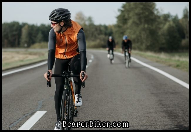 Cyclists with bicycles on the road